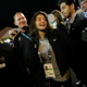 Refugee Olympic Team's Yusra Mardini, center, smiles during a welcome ceremony held at the Olympic village ahead of the 2016 Summer Olympics in Rio de Janeiro, Brazil, Wednesday, Aug. 3, 2016.